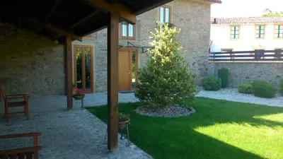 a house with a christmas tree in a yard at Casa da Paioca in Paleo