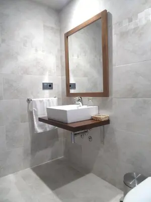 a bathroom with a sink and a mirror at Casa da Paioca in Paleo