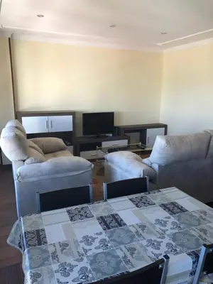 a living room with two couches and a table at Apartamento Vistas al mar in Foz