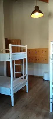 a room with two bunk beds and a light at Casa Lixa Hotel Rural Albergue in Las Herrerías