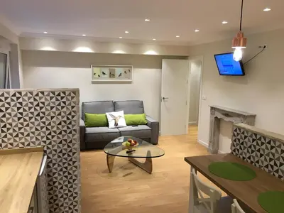 a living room with a couch and a table at Rentxacobeo in Sarria