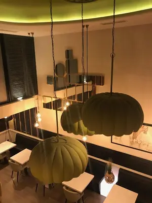 two large green hanging lights in a restaurant at Coto Real in Rábade