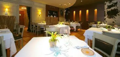 a dining room with white tables and white tablesearcher at Coto Real in Rábade