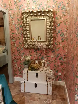 a bathroom with a sink and a mirror on a wall at La Calleja in Arzúa