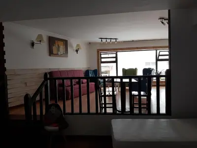 a room with a balcony with chairs and a couch at Monqar in Foz