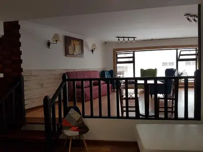 a living room with a couch and chairs at Monqar in Foz