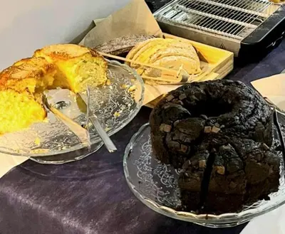 a table with two plates of cakes and pastries at Pensión LO in O Pedrouzo