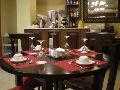 a table with red napkins and glasses on top of it at La Casona de Lazúrtegui in Ribadeo