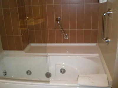 a bath tub in a bathroom with a shower at La Casona de Lazúrtegui in Ribadeo