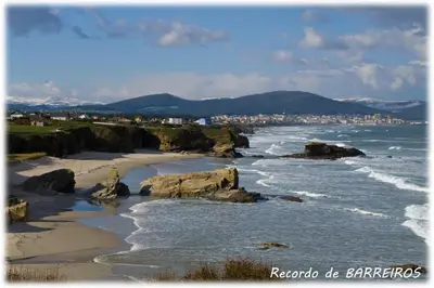 a view of the ocean with a beach and a city at Hotel Amadora - Admite mascotas in Barreiros