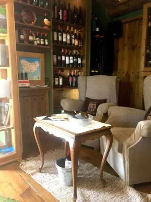 a living room with a table and a couch at Alcázar Milmanda in Milmanda