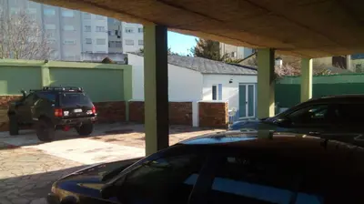 a car parked in a parking lot next to a building at Santa Cruz in Ribadeo