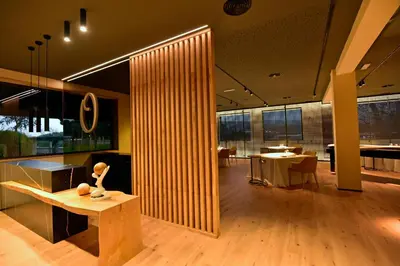 a living room with a table and a dining room at Hotel Scala in Padrón