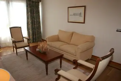 a living room with a couch and a table at Pousada de Portomarín in Portomarin