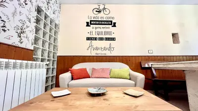 a living room with a couch and a table at La Casa Antollosdocesar in Baralla
