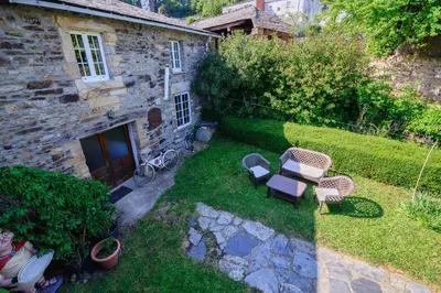 an overhead view of a garden with two chairs and a table at La Casa Antollosdocesar in Baralla