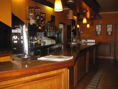 a bar in a restaurant with a counter at Hotel Ramos in Silleda