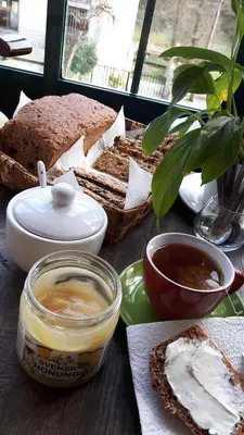 a table with bread and other foods on it at Casa Licerio in Samos