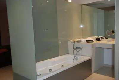 a bathroom with a shower and a bath tub at Posada Real La Pascasia in Puebla de Sanabria
