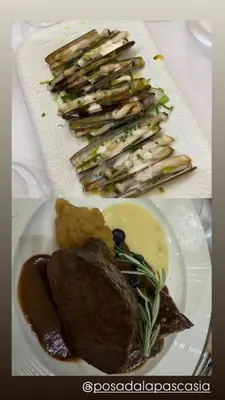 a plate of food with meat and vegetables on it at Posada Real La Pascasia in Puebla de Sanabria