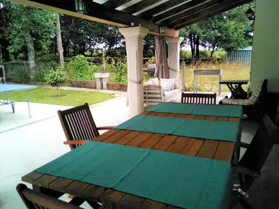 a bedroom with a bed and a chair and a desk at Villa Albaredo in Villameá