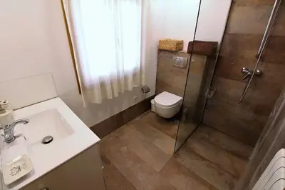 a bedroom with a large bed with towels on it at Villa Albaredo in Villameá
