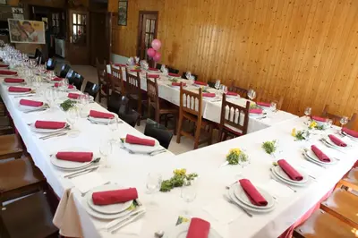 a group of tables with red napkins on them at Hotel Santa Cruz in Montaos