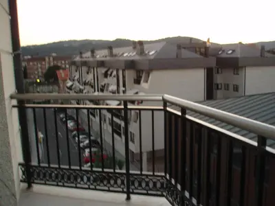 a balcony with a view of a parking lot at Descanso Termal in Ourense
