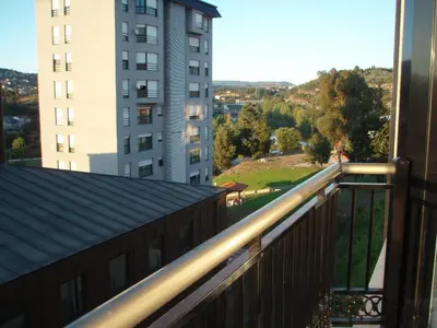 a view from a balcony of a building at Descanso Termal in Ourense
