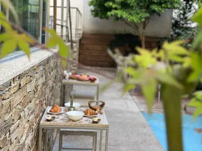 a tray of food on a table next to a wall at Hotel Santa Clara in Santiago de Compostela