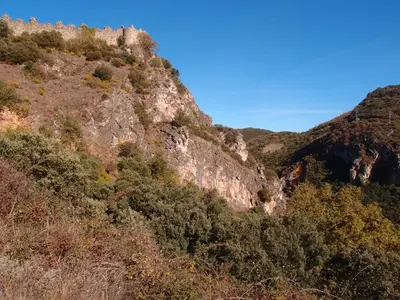 a view of a mountain with trees on it at Albergue Casa del Pescador in Ambasmestas