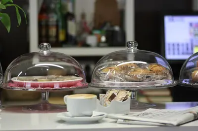 two glass bowls with food in them on a table at Hotel Pontes do Eume in Puentes de García Rodríguez