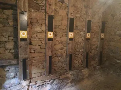 a stone wall with a row of lights on it at Casa la Devesa de Sanabria in Remesal