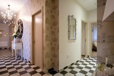 a hallway with a black and white checkered floor at La Casona de Nené in Arzúa