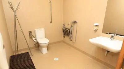 a bathroom with a toilet and a sink at El Albergue del Montero in Mondoñedo