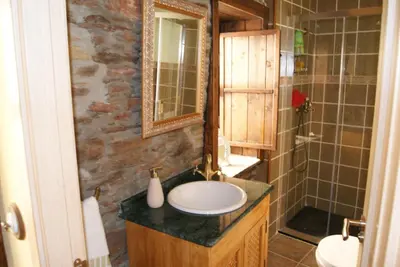 a bathroom with a sink and a shower at Casa Bell in Manzanedo de Valdueza