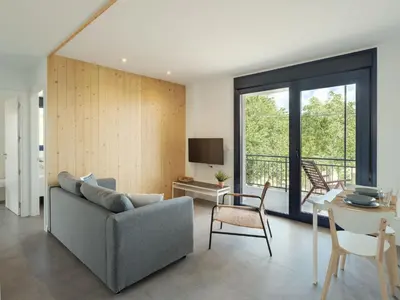 a living room with a couch and a table at Apartamentos Ribeira Sacra in Parada del Sil
