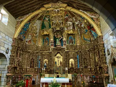 a large gold altar in a church at Casa Blanco Conde in Laza