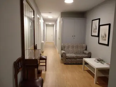 a living room with a couch and a table at Hostal Buenavista in San Ciprián