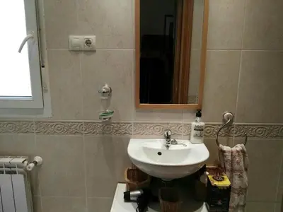 a bathroom with a sink and a mirror at Foz Playa y Mar by I Love Norte in Foz