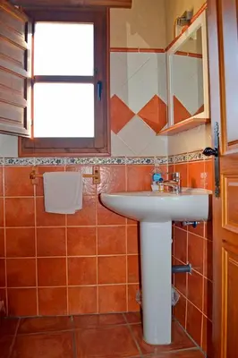 a bathroom with a sink and a window at Pedrazales Rural in Pedrazales