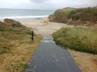 a path leading down to the beach at Apartamentos Alejandra in Barreiros