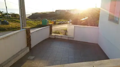 a balcony with a view of the ocean at Apartamentos Alejandra in Barreiros