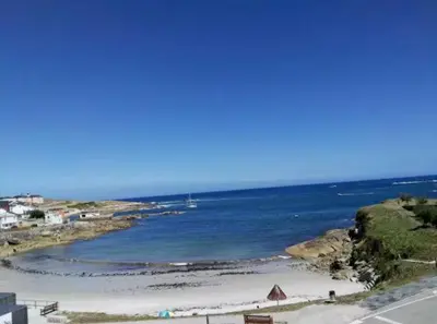 a view of a beach with the ocean at San Ciprián Playa y Mar by I Love Norte in San Ciprián