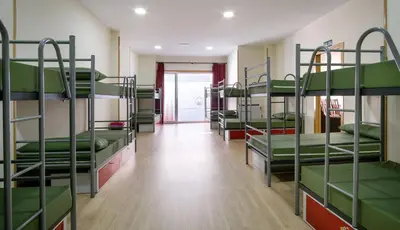 a group of bunk beds in a room at Albergue Pensión Cima do Lugar in Arzúa