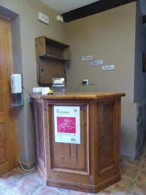 a wooden podium with a sign on it in a room at Hotel Rural La Casa de Irene in Lubián