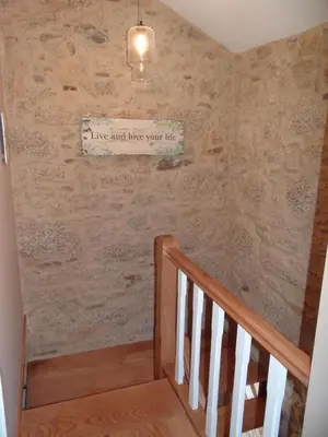 a staircase with a sign that reads have and love your life at Casa do Forno in Castro de Oro