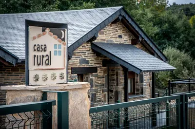 a sign in front of a small building at Casa Rural 
