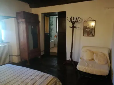 a bathroom with a tub and a toilet and a sink at Las 3 Negrillas in Toral de Merayo