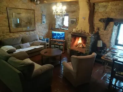 a bedroom with a bed and a lamp in it at Las 3 Negrillas in Toral de Merayo